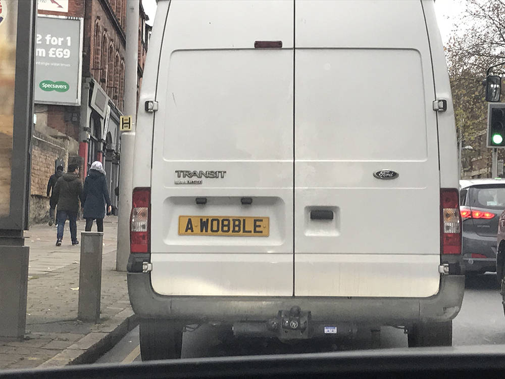 Wobble number plate