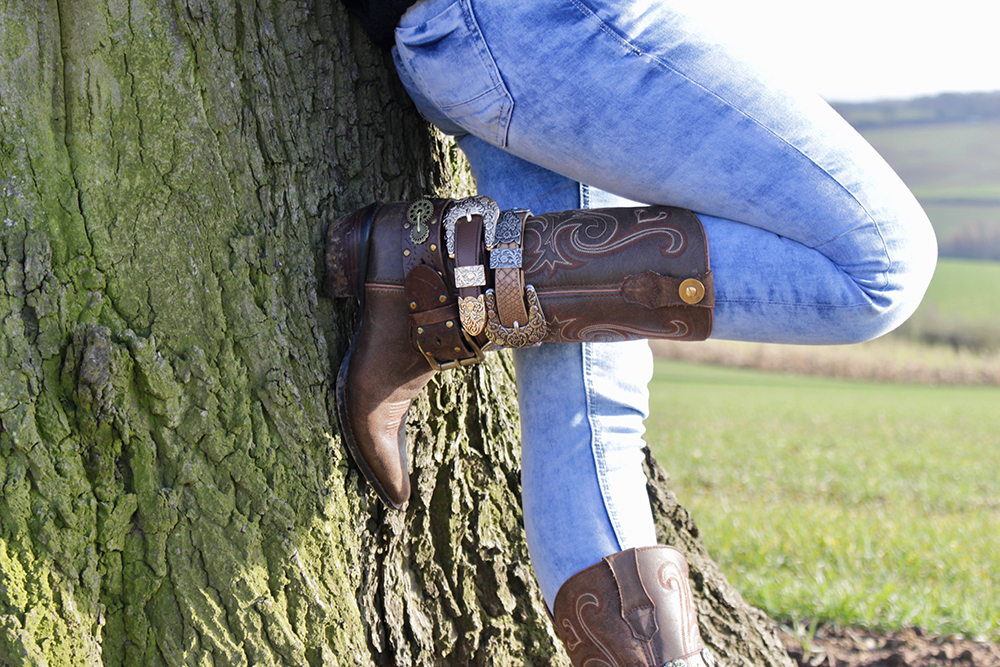 Girl in Boot JuJu near tree