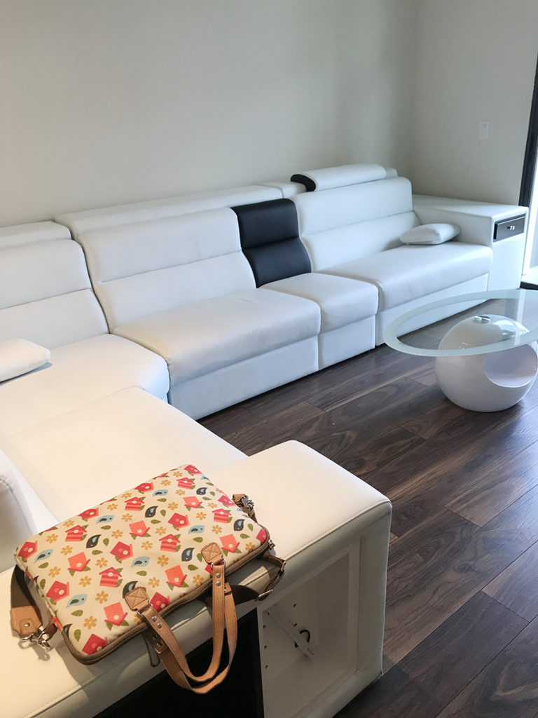 Large white couch in apartment