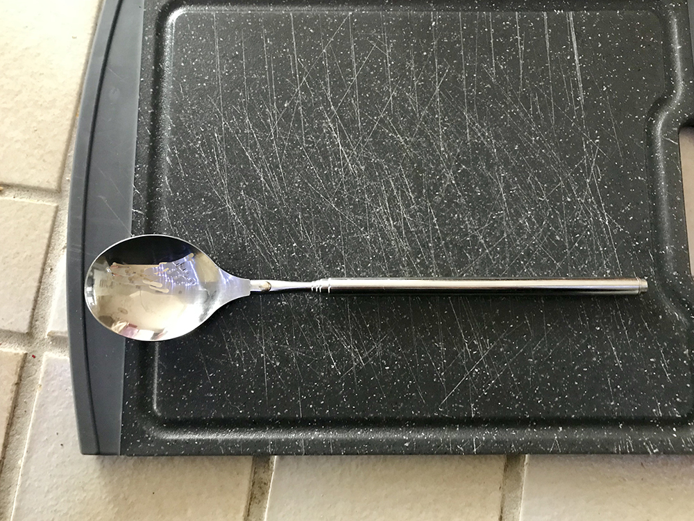 spoon on chopping board