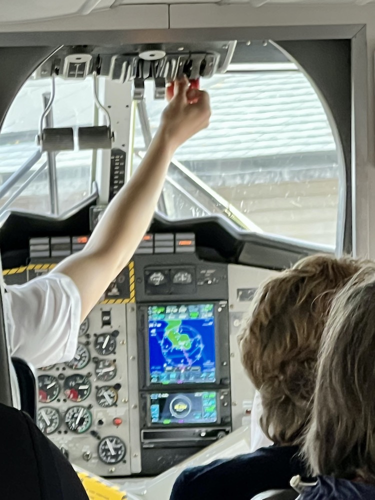 pilot inside the Twin Otter plane to the Scilly Isles