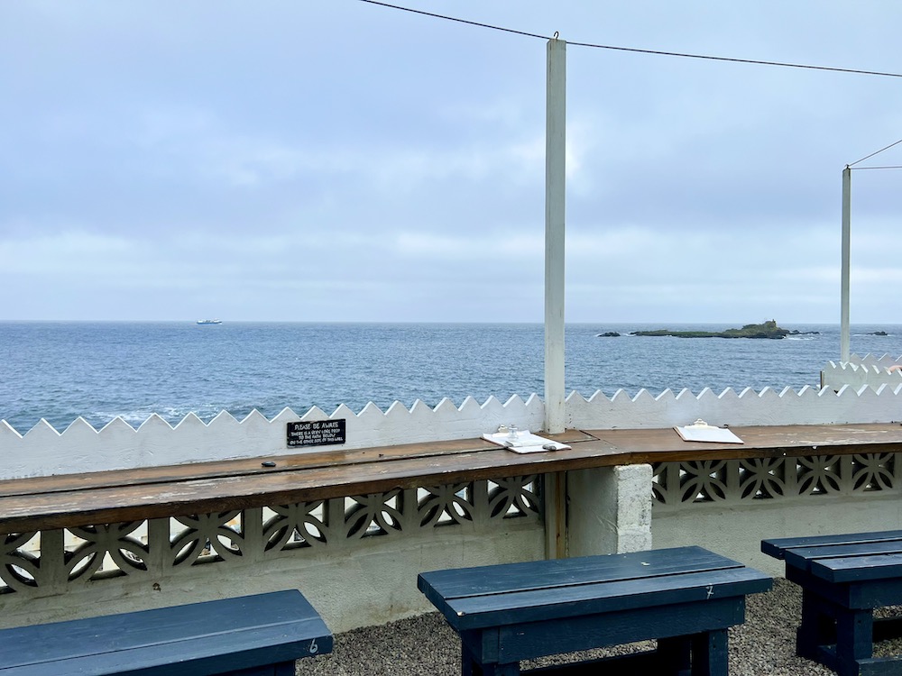 View of the sea from The Rock Pool Cafe in Mousehole, Cornwall
