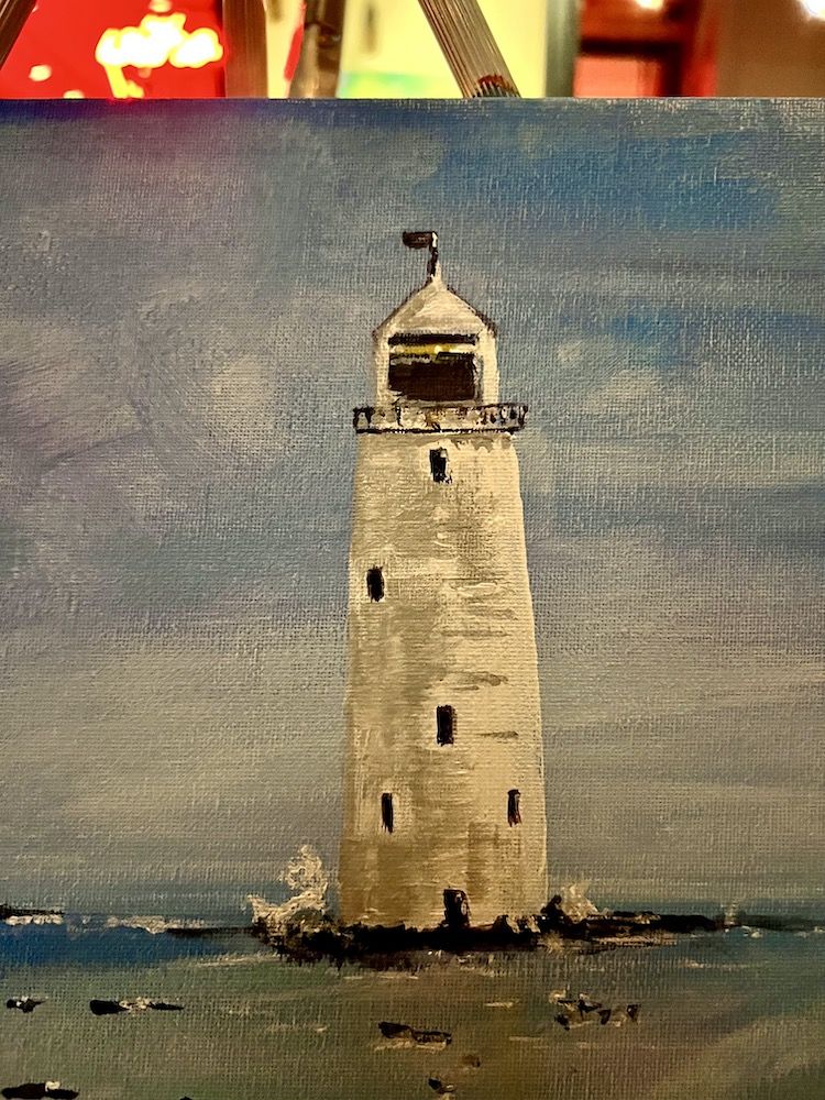 A lighthouse painted in acrylic paint