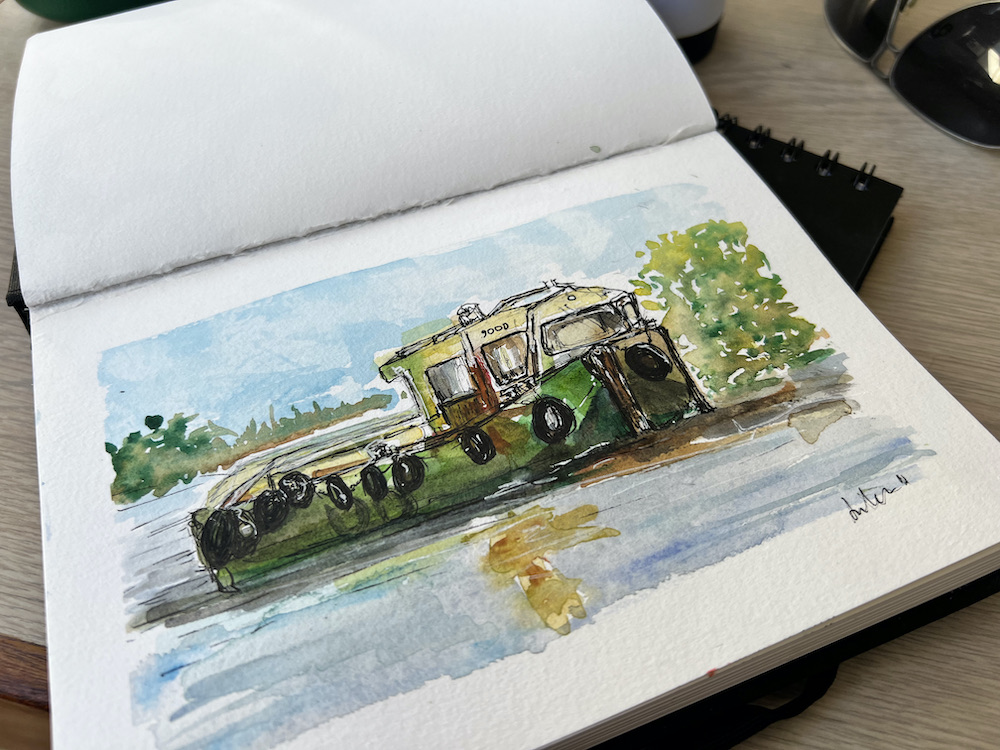 A watercolour of a boat moored on the river.