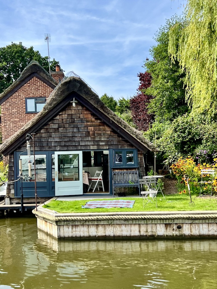 a house on the banks of the river in the Norfolk Broads