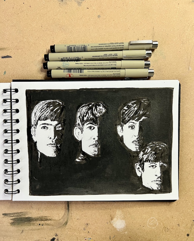 An ink drawing in black and white of The Beatles in a sketchbook