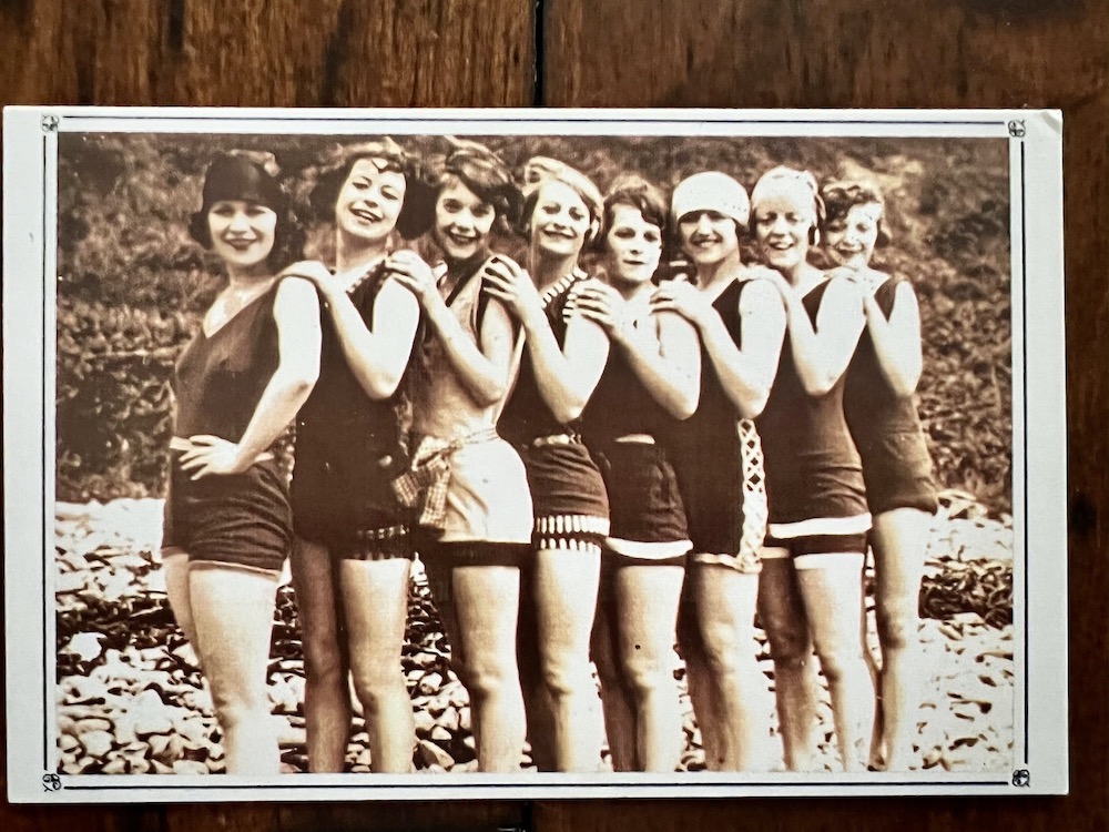 A group of girls in their bathing suits posing for a photograph in 1927